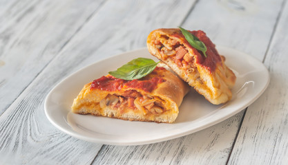 Homemade calzone on the plate