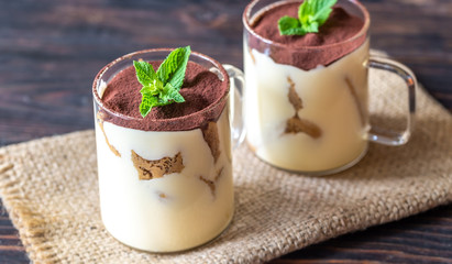 Two glass mugs of tiramisu