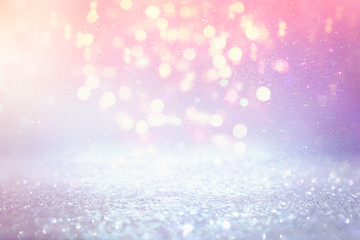 background of abstract glitter lights. purple, pink, gold and silver. de focused