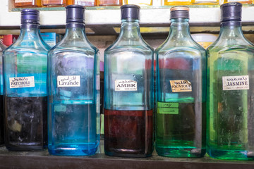 Morocco, Marrakech, Jemma El Efna, Souk, colorful bottles of fragrances for sale.