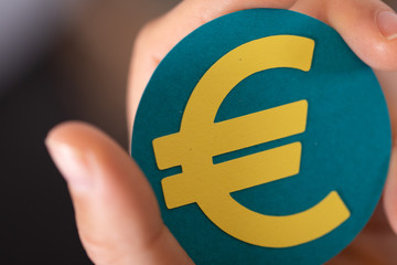 euro symbol paper in hand
