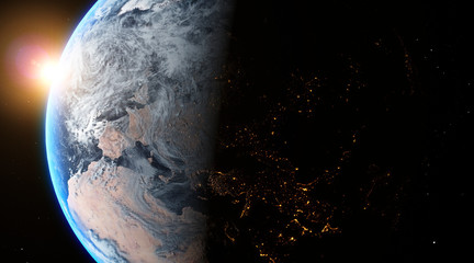 Sunrise over the planet Earth concept with a bright sun and flare and city lights