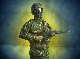 Hazard, menace soldier in a ruined crumbly building with arms on his hand
