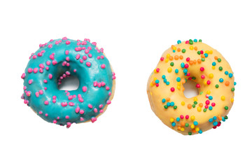 Blue and yellow donuts with bright sprinkles, isolated, food concept