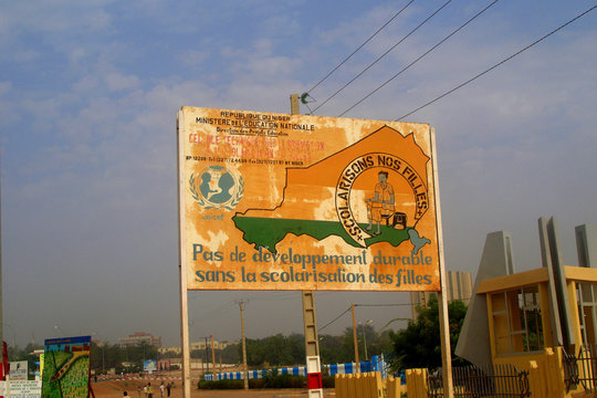 Niger, Niamey, Old and used advertising panel from the ministry of education and the UNICEF, promoting girls¥education