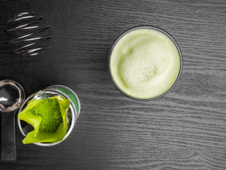 Matcha green tea latte in a cup. Detox concept, Top view. Copy space.