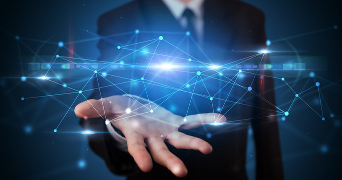 Handsome person holding hologram screen displaying modern cloud based web system technology