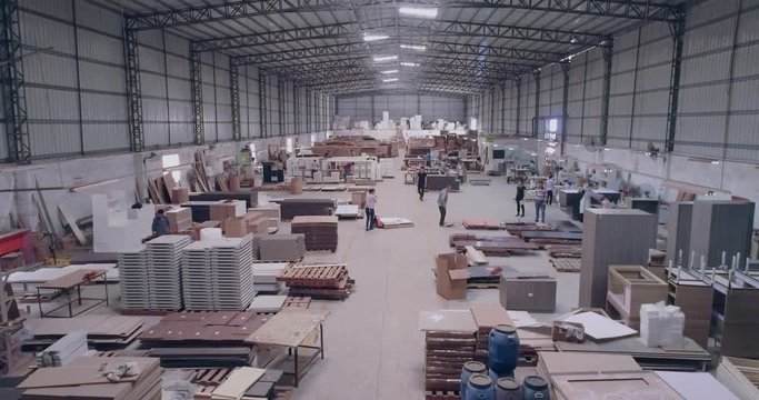 Manufacture of furniture from wood boards and MDF. Assembly of furniture at a furniture factory in China. Workshop work in a furniture factory.