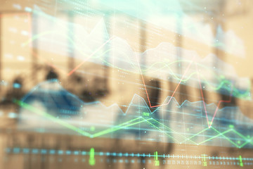 Fototapeta premium Stock and bond market graph with trading desk bank office interior on background. Multi exposure. Concept of financial analysis