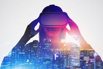 Astonished woman in VR glasses in night city