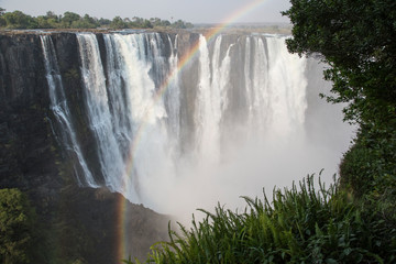 Africa, Zimbabwe, Victoria Falls. Landscape of waterfall and rainbow.