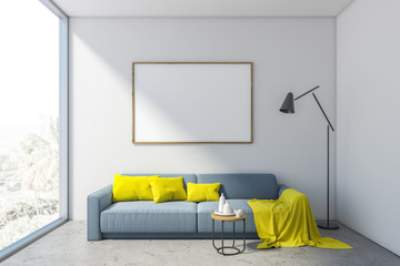 White living room with sofa and horizontal poster
