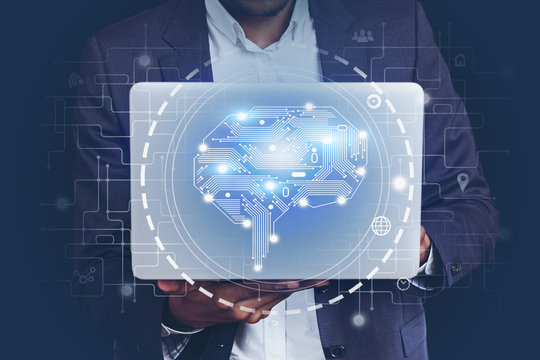 African man with laptop, AI brain hologram - Powered by Adobe