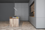 Side view of gray kitchen with bar