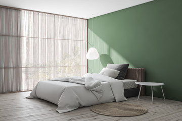 Green bedroom corner with blinds