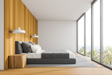 Side view of panoramic white and wood bedroom