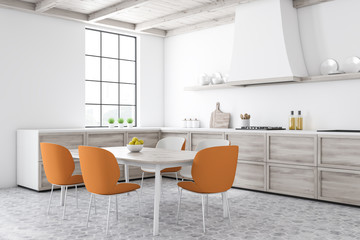 White kitchen corner with dining table