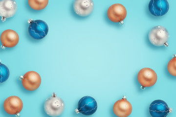 Christmas frame with copy space. Blue, golden and silver balls on blue background