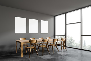 Gray dining room corner with poster gallery