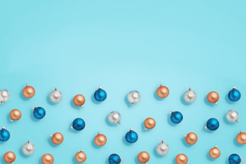 Christmas baubles. Blue, golden and silver balls on blue background