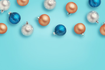 Christmas baubles. Blue, golden and silver balls on blue background