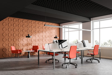 Bright orange office corner with lounge area