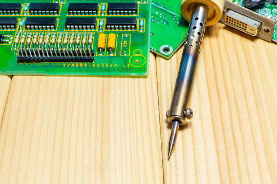 Services for the production of electronics and repair on a wooden background.