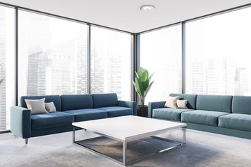 Panoramic living room corner with blue sofas