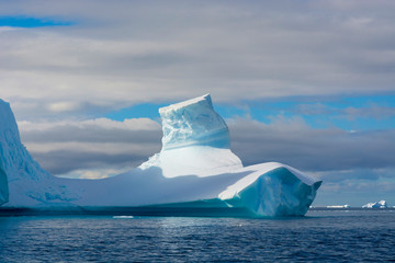 Antarctica. Gerlache Strait. Iceberg with an unusual shape.
