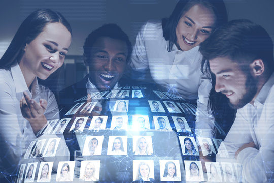 Happy business team with laptop, social media