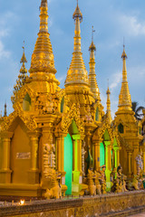 Fototapeta premium Myanmar. Yangon. Shwedagon Pagoda. Golden spires gleam at twilight.