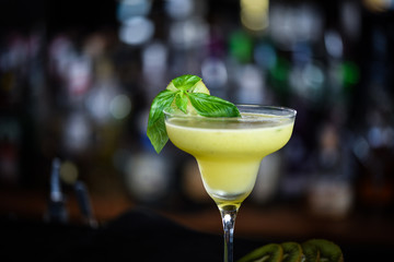 kiwi cooler cocktail with fresh basil & ice