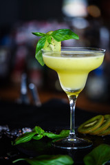kiwi cooler cocktail with fresh basil & ice