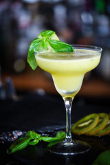 kiwi cooler cocktail with fresh basil & ice