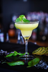 kiwi cooler cocktail with fresh basil & ice