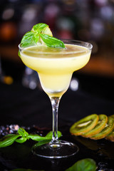 kiwi cooler cocktail with fresh basil & ice