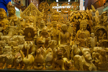 Myanmar. Yangon. Bogyoke Aung San Market. Carved wooden figures.