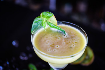 kiwi cooler cocktail with fresh basil & ice