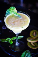 kiwi cooler cocktail with fresh basil & ice