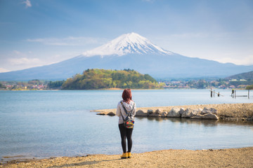 Fototapeta na wymiar Mt diamond fuji with snow and flower garden along the lake walkway at Kawaguchiko lake in japan, Mt Fuji is one of famous place in Japan. 
