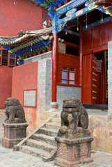 Asia, China, Yunnan Province, Mojiang. Two lion sculptures at the Confucious temple entry gate.