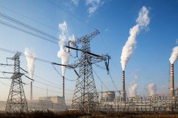 China, Shanxi Province, Datong, Steam and smoke rises from smokestacks at coal-fired Datong No. 2 Power Station at dawn