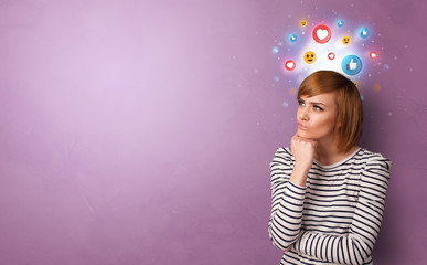 Business person standing with social media and emoticons concept