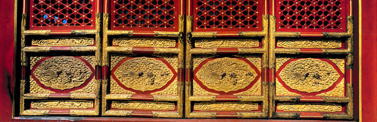 Asia, China, Beijing. Ancient lacquered doors shield the Hall of Perfect Harmony, or Zhonghedian Hall in the Forbidden City, a World Heritage Site, Beijing, China.