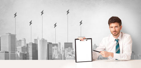 Announcer sitting at desk presenting the city energy consumption