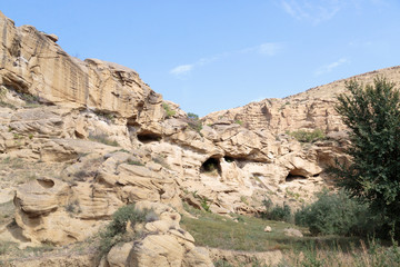 Georgia, Uplistsikhe. Stone cliff faces at the Uplistsikhe Cave Complex.