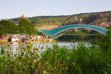 Bridge of Peace over Mt'k'vari (Kura) River and cityscape. Tbilisi, Georgia. © Keren Su/Danita Delimont