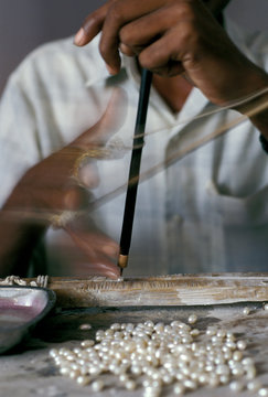 Asia, India, Hyderabad. Hand Drilling Pearls.