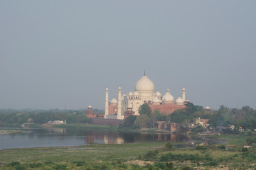 Fototapeta na wymiar India, Agra. View of the Taj Mahal from the Red Fort of Agra. Sandstone fortress founded in 1565. UNESCO World Heritage Site.