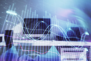 Stock market chart and desktop office computer background. Multi exposure. Concept of financial...